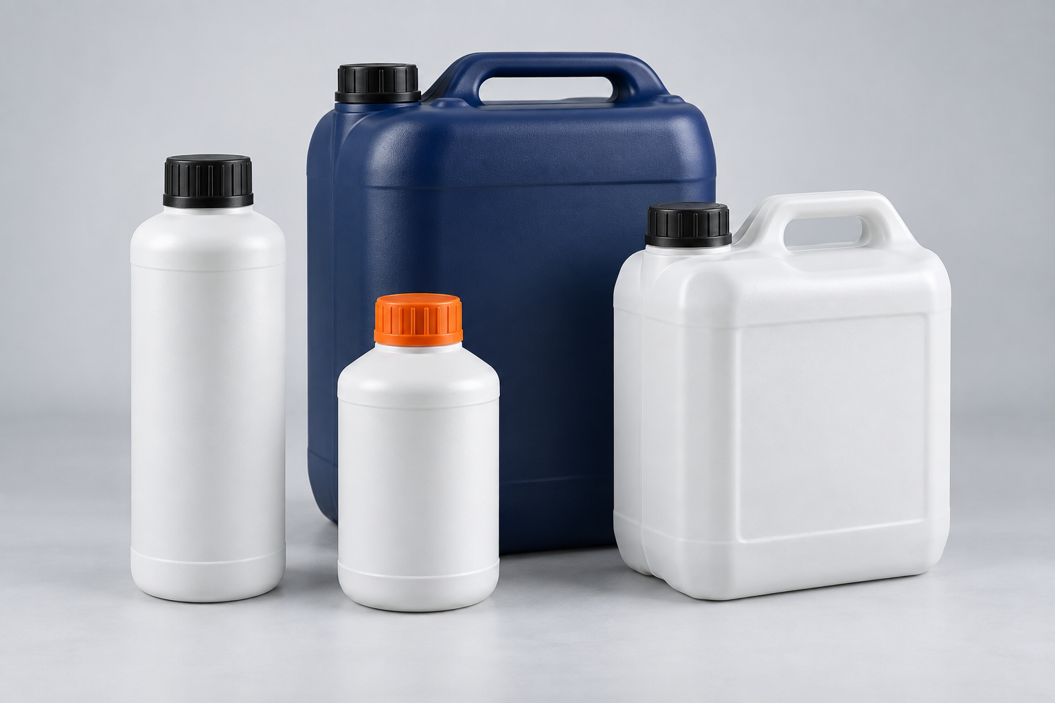 White chemical bottles and handled jerrycans with black and orange closures, alongside a navy jerrycan